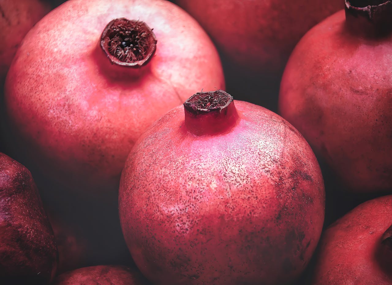 Vibrant close-up shot capturing fresh and juicy pomegranates, perfect for healthy lifestyle imagery.